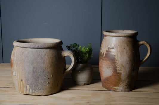 Pair of antique French confit pots with rustic stoneware glaze and original handles.