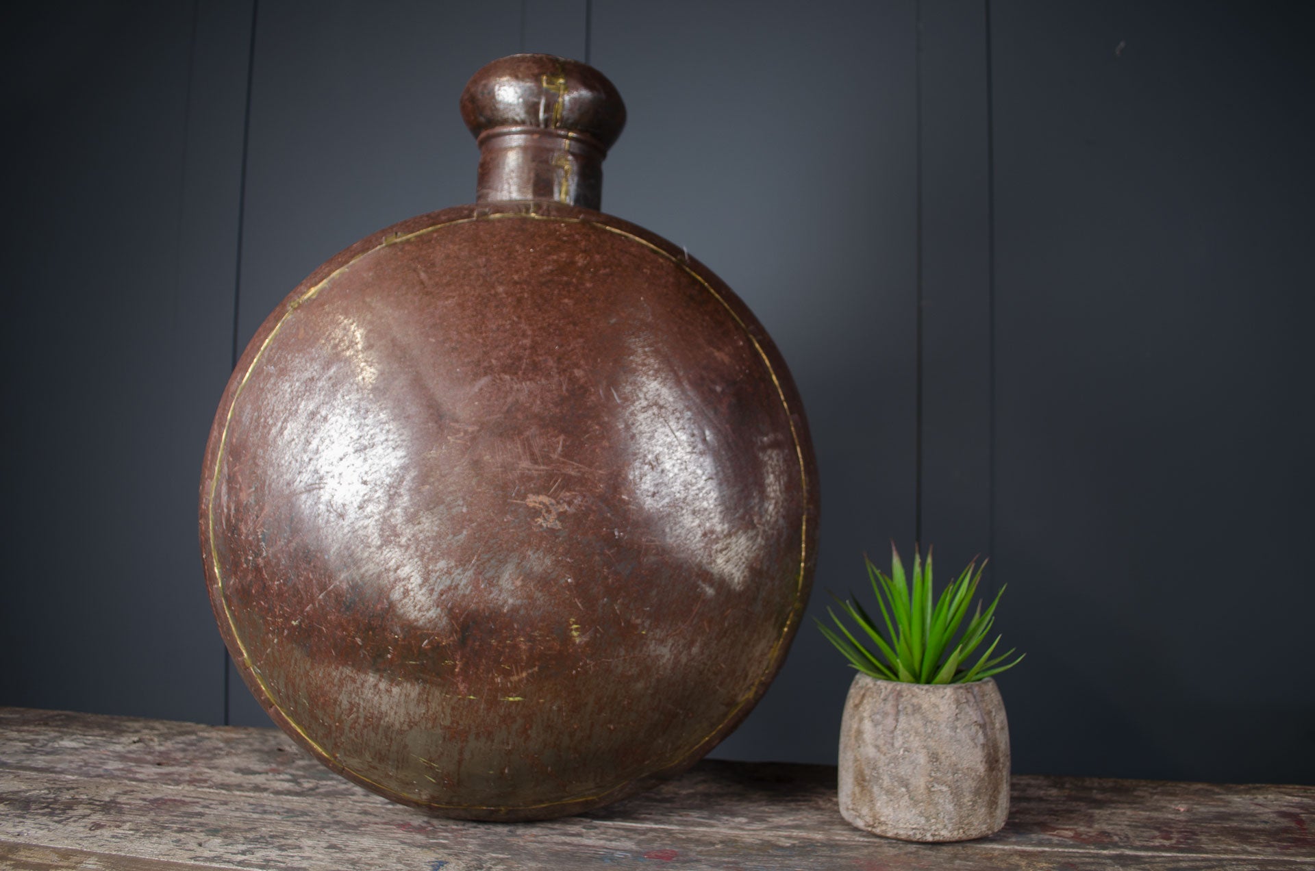 antique Indian water carrier bottle
vintage Indian vessel décor
brass welded water pot
rustic Indian home décor
antique decorative bottle
Indian sideboard décor
polished antique water carrier
large Indian display vessel