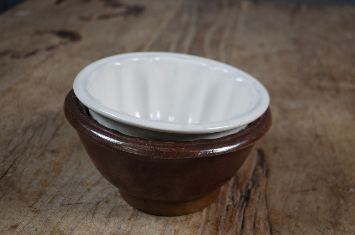 iron stone bowl Pair of antique ceramic jelly moulds with fluted detail