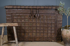 antique indian dowry chest in dark wood with ironwork and a turkish olive jat