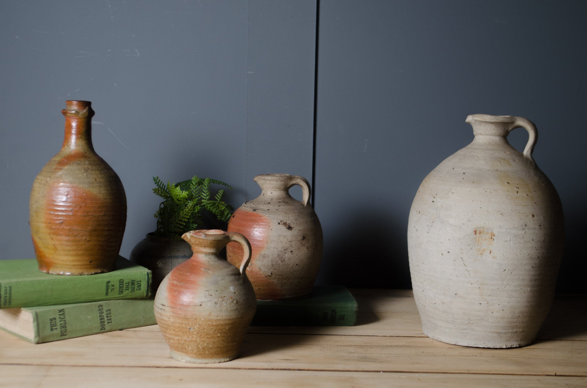 
Antique French stoneware vinegar jar with handle and warm cream and terracotta glaze.