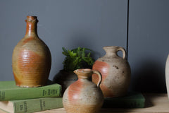 Authentic French pottery oil bottle used as a decorative single stem vase.
