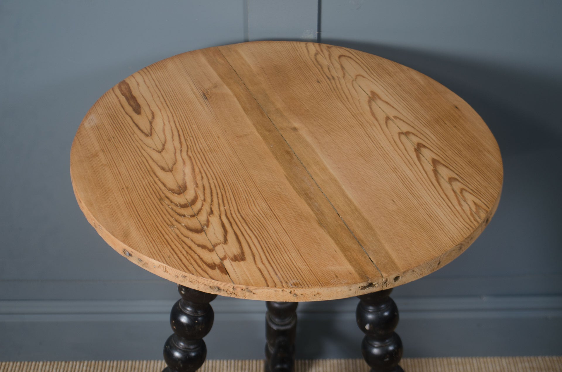 
Antique Victorian bobbin turned table with decorative spindle legs and aged patina.