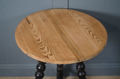 Antique Victorian bobbin turned table with decorative spindle legs and aged patina.