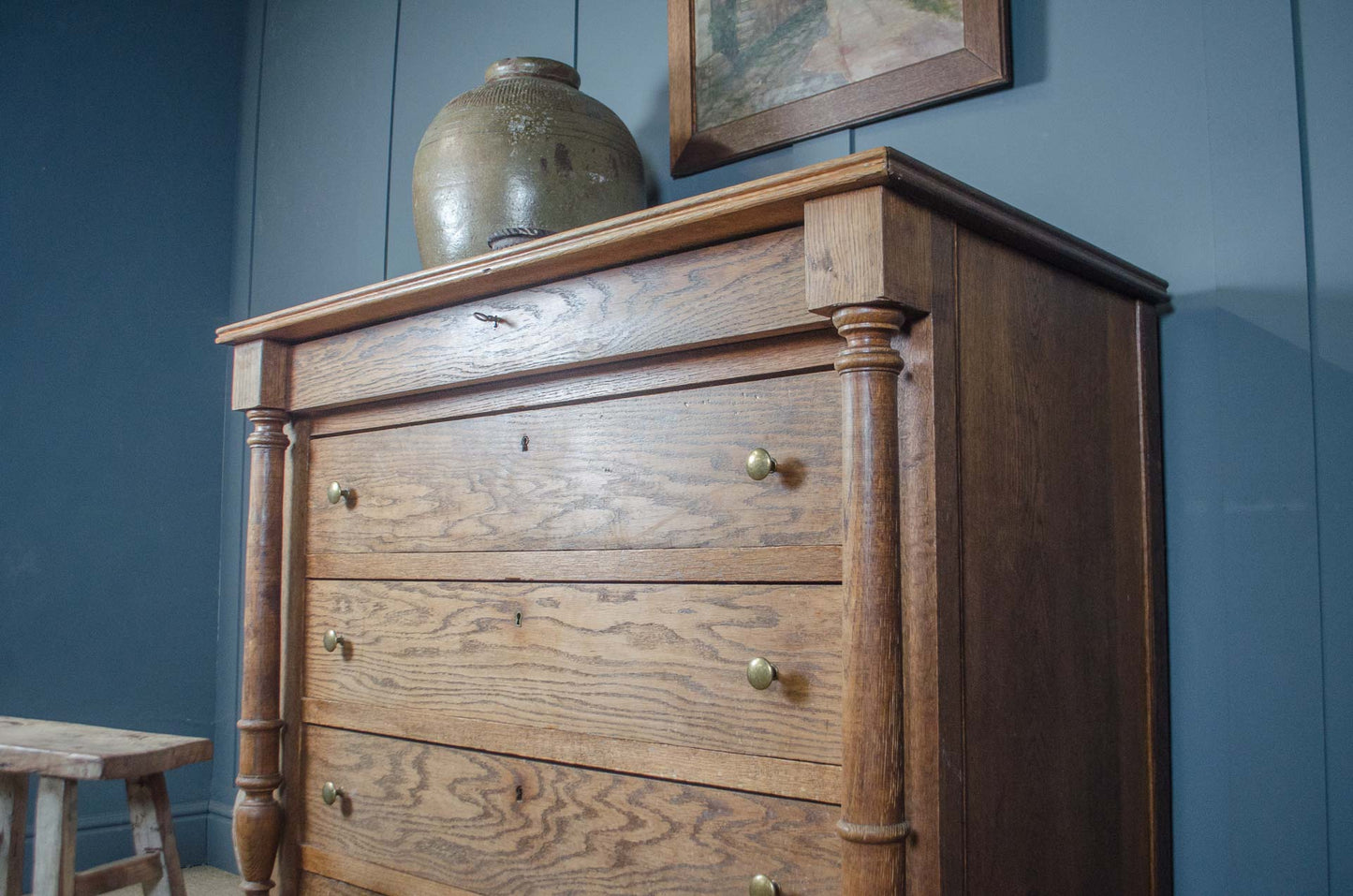 Turned column detail on antique French oak chest