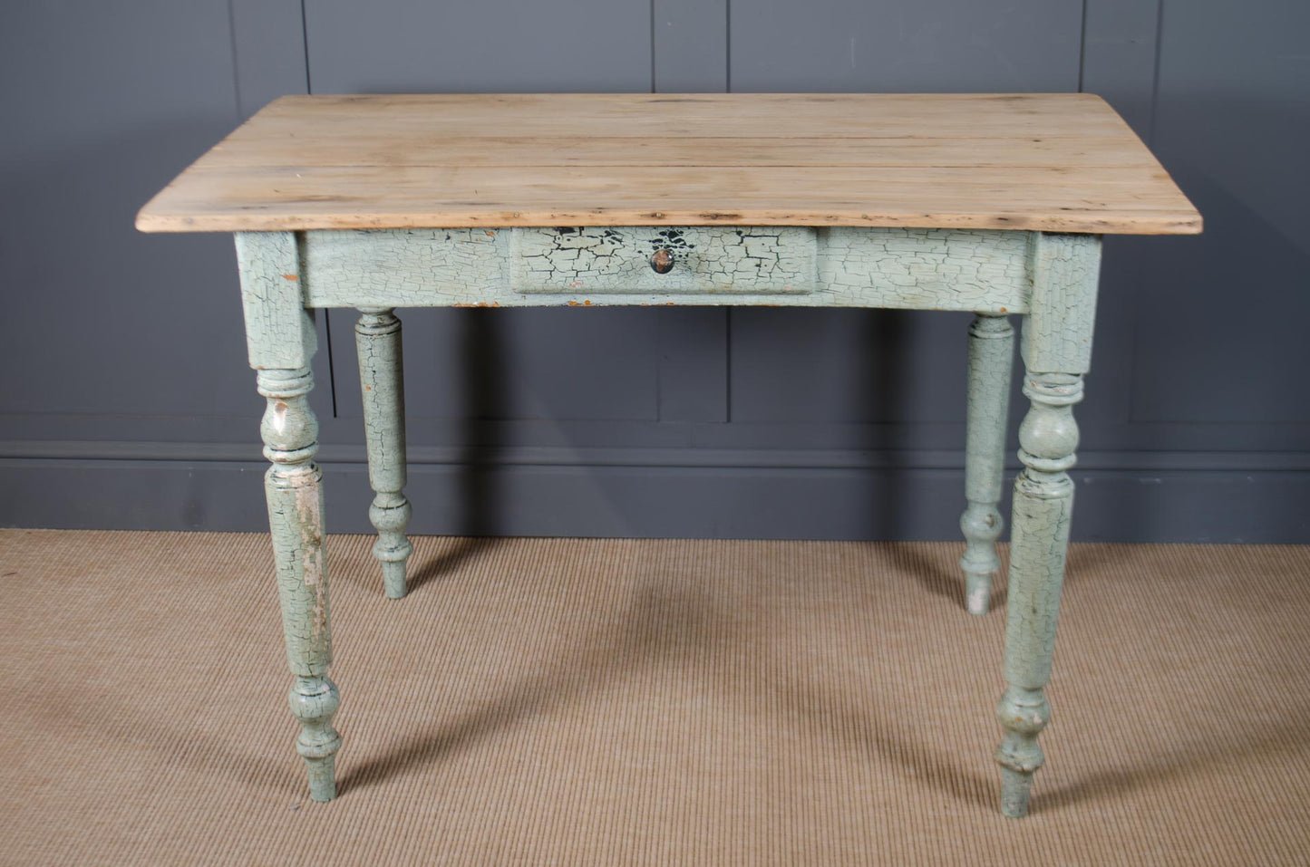 Vintage pine desk with painted base and natural wood top.