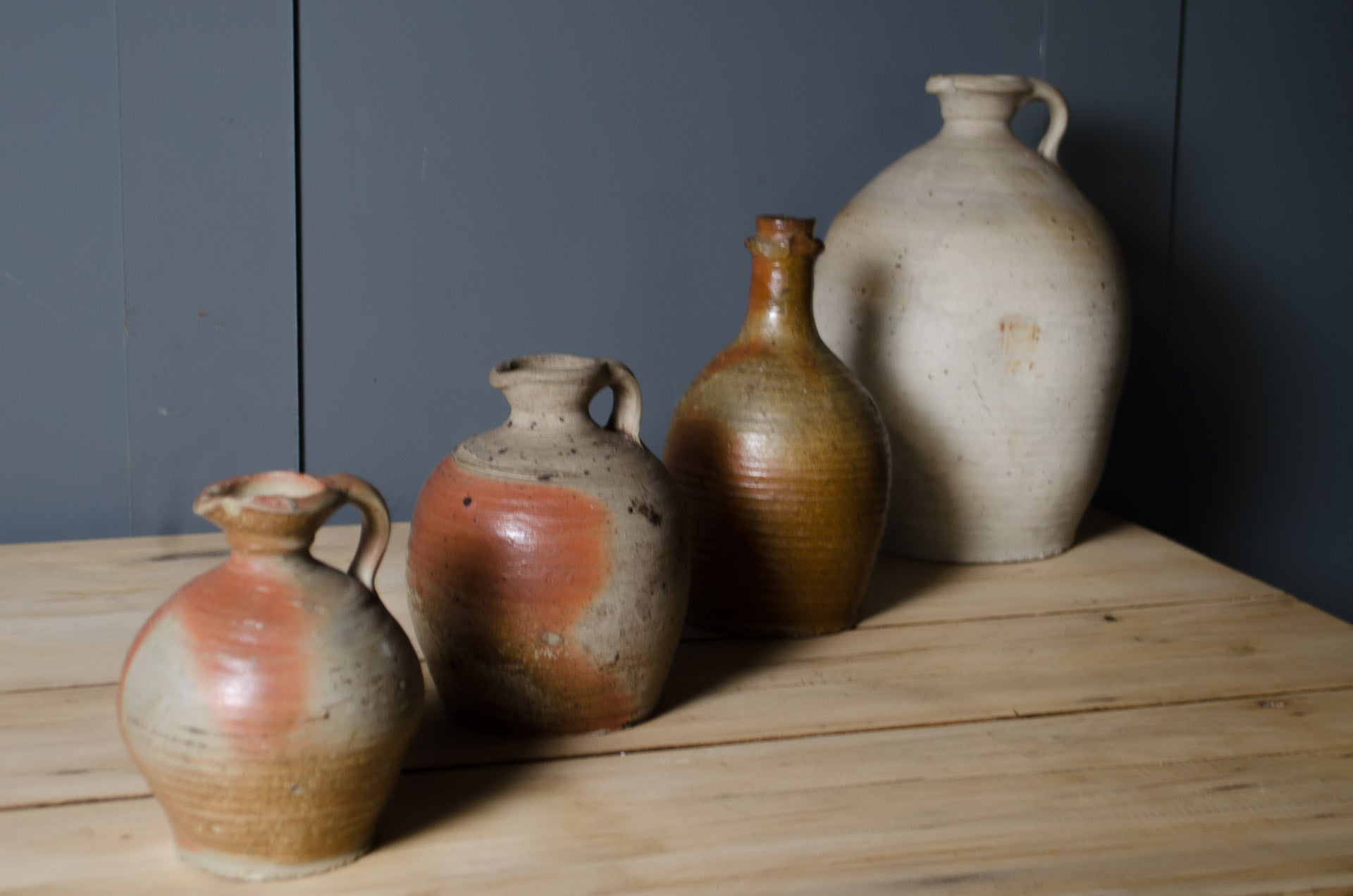 
Antique French stoneware vinegar jar with handle and warm cream and terracotta glaze.