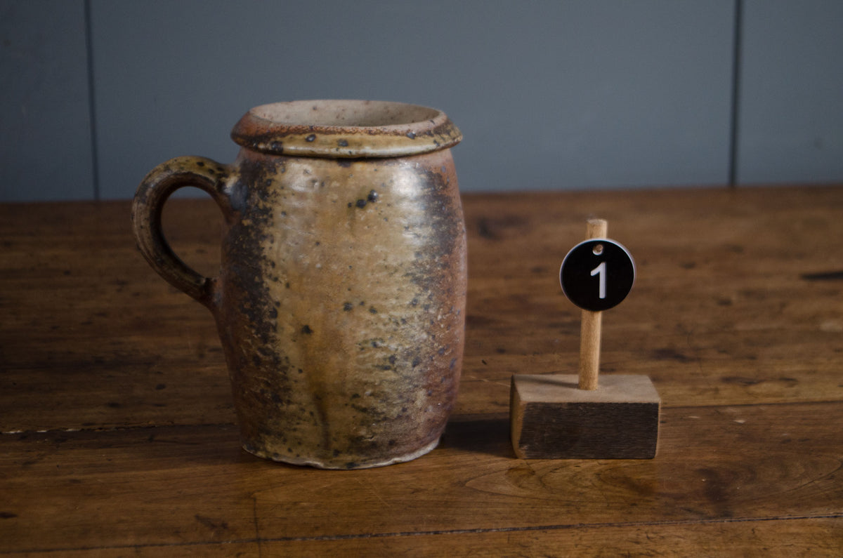 
French stoneware pots and jugs in ochre and brown glazes