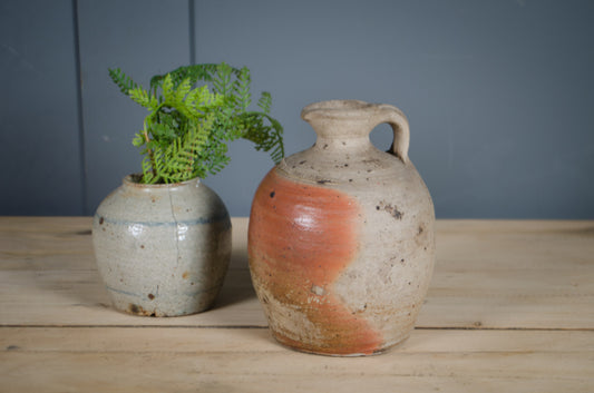 Antique French vinegar jar displayed as a decorative pottery vase.