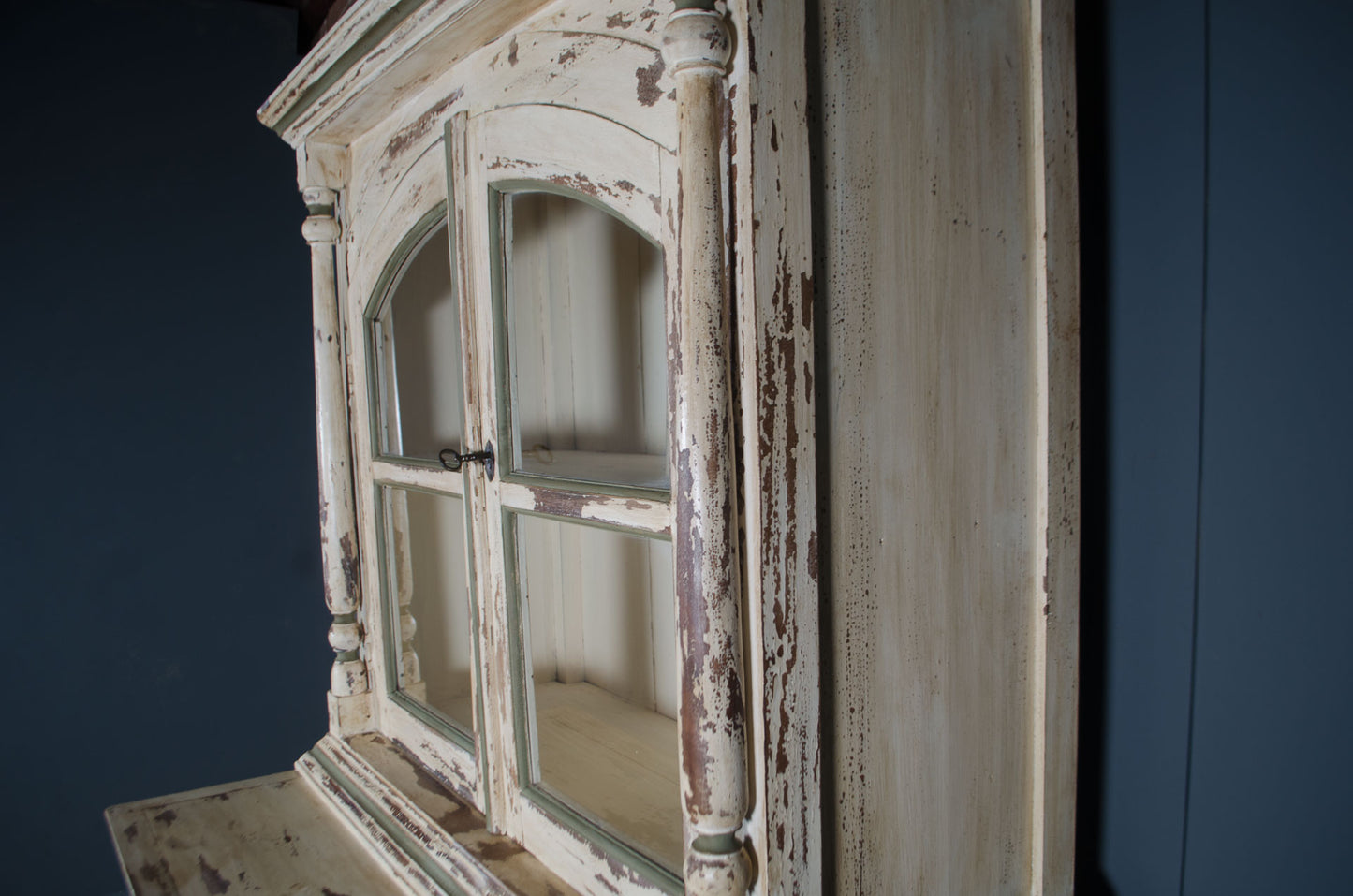 Heavy cream painted drinks cabinet with sage green detailing