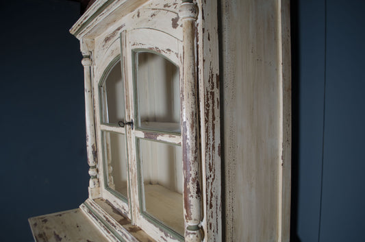 Heavy cream painted drinks cabinet with sage green detailing