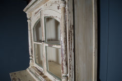 Heavy cream painted drinks cabinet with sage green detailing