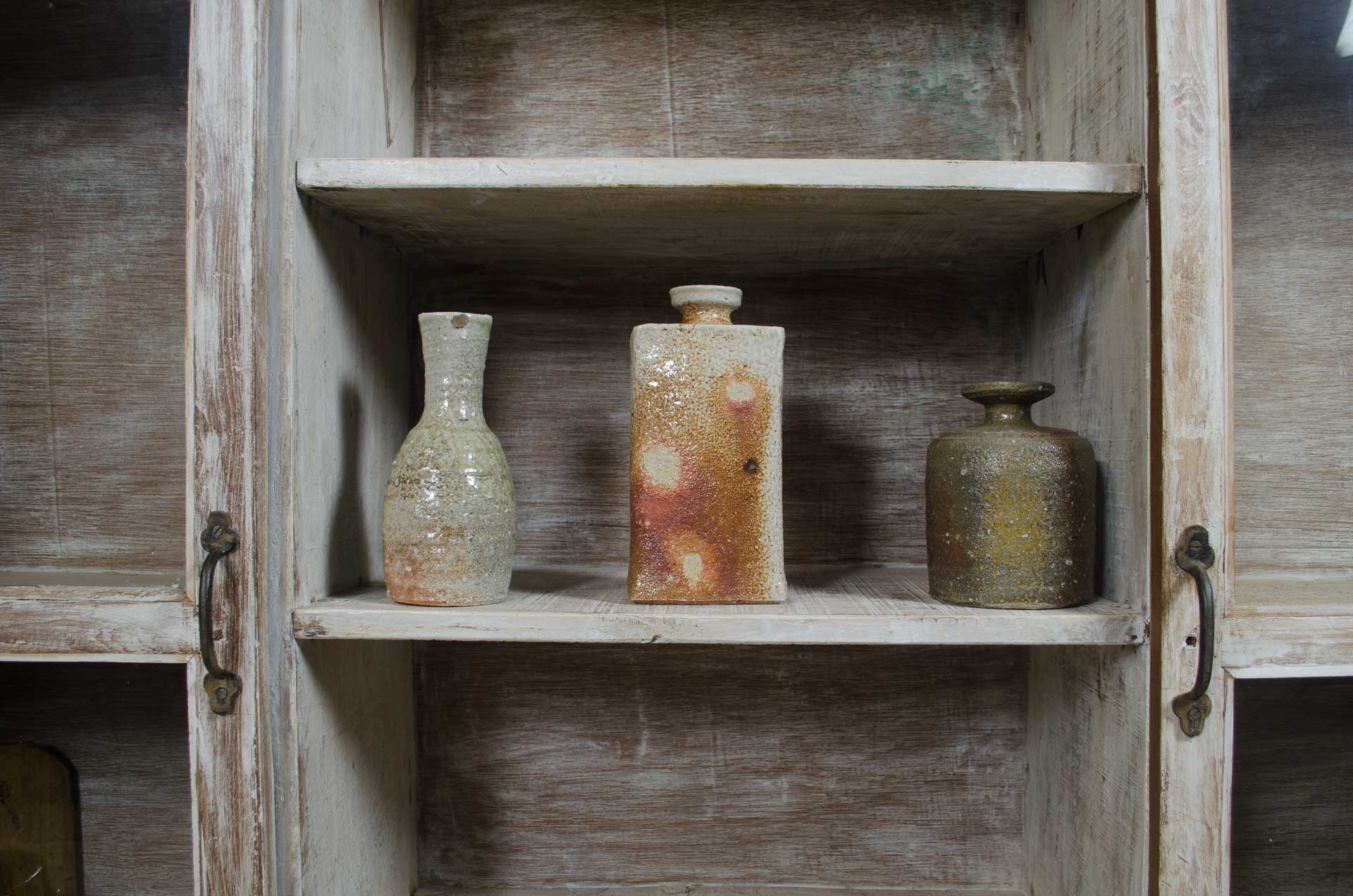 japanese pottery in cupboard