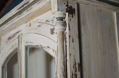 Solid wooden dresser cabinet in cream paint with green highlights