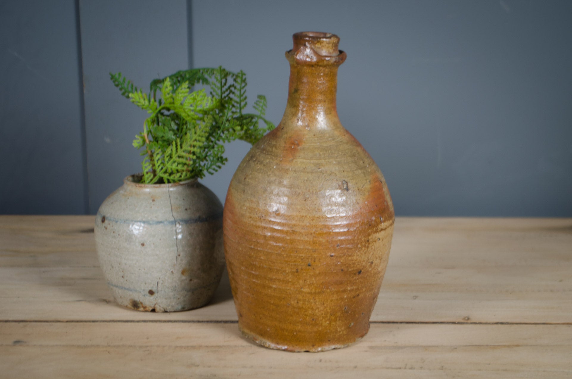 Antique French stoneware oil bottle with warm honey brown salt glaze finish.
