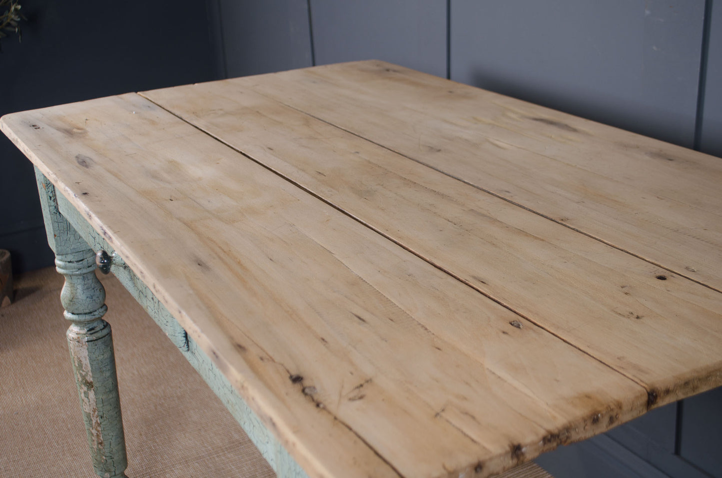 Pitch pine plank top table with distressed duck egg painted legs.
