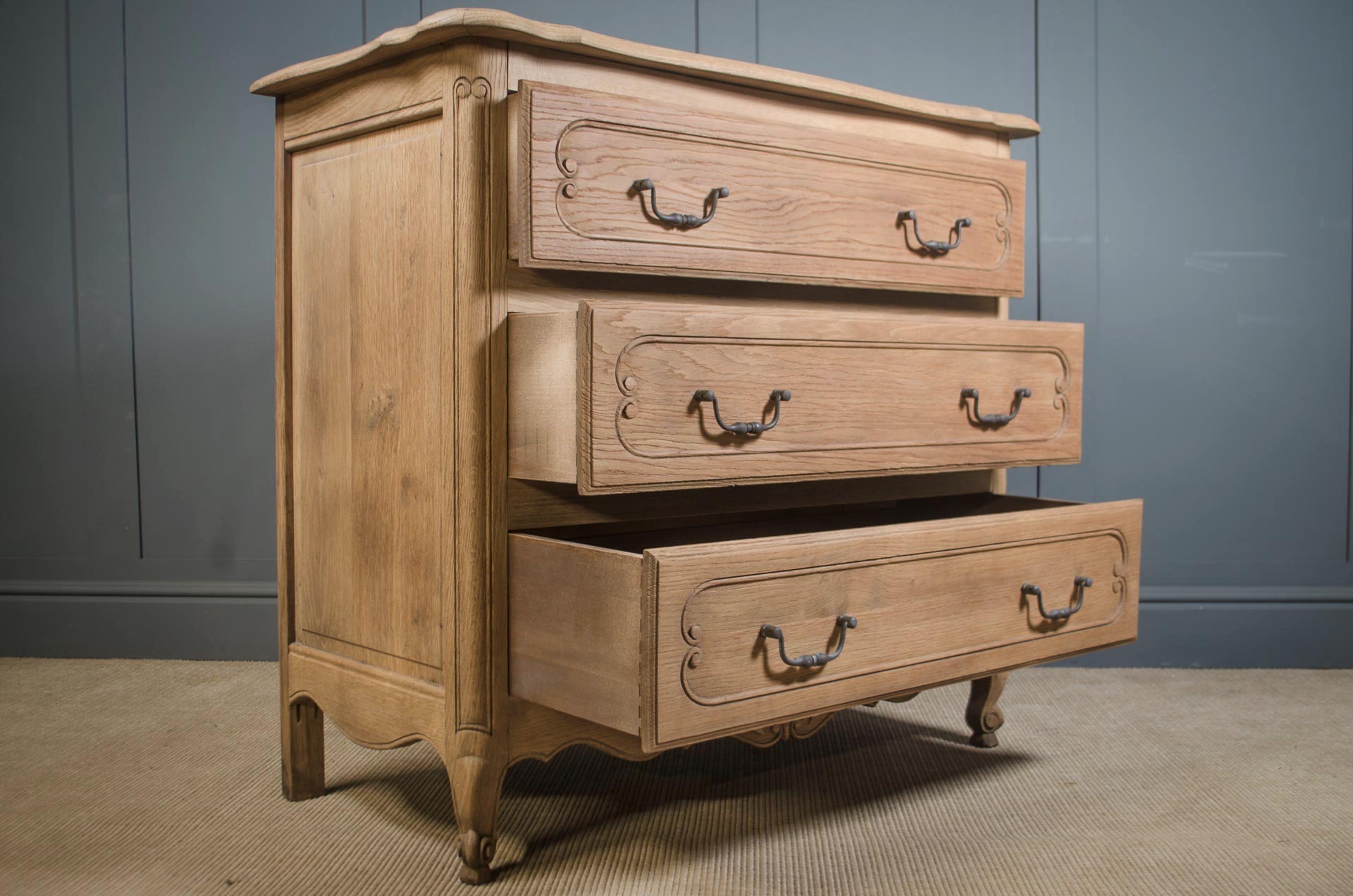 French antique oak chest of drawers with parquet top and iron handles