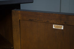 Wooden surface with a 'Younger' label on a blurred background