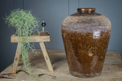 Fantastic rustic decorative pots in a tactile olive green or mid brown glaze. Originate from northern China where they were used to store prized rice wine. An unusual rare find, making them the perfect addition to any modern rustic interior decor. Add to a the corner of a room or sideboard with dried seed heads or autumnal branches for a unique focal point.&nbsp;The variations in colour and slight imperfections are signs of history and character behind each pot. Choose your favourite from the dropdown menu.