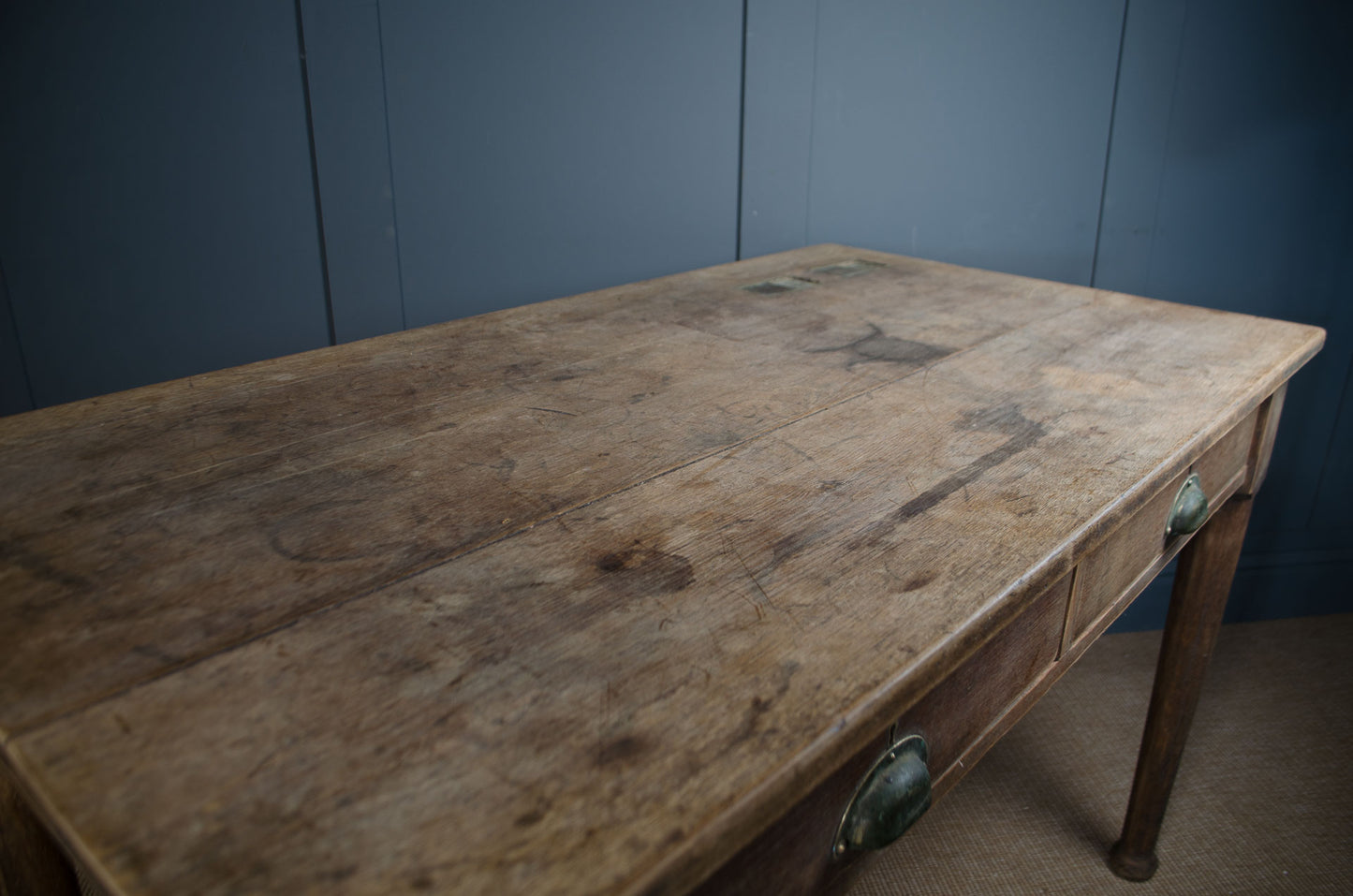 Vintage oak desk styled as a kitchen table with wooden stool