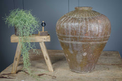 Fantastic rustic decorative pots in a tactile olive green or mid brown glaze. Originate from northern China where they were used to store prized rice wine. An unusual rare find, making them the perfect addition to any modern rustic interior decor. Add to a the corner of a room or sideboard with dried seed heads or autumnal branches for a unique focal point.&nbsp;The variations in colour and slight imperfections are signs of history and character behind each pot. Choose your favourite from the dropdown menu.