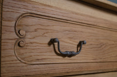 Close up of parquet oak top on French antique chest of drawers