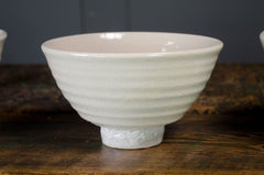 beige crackle glazed hand thrown bowl, made in devon on a rustic wood table