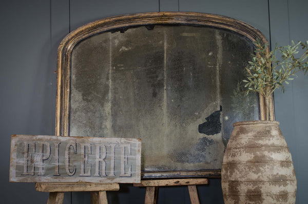 Antique over mantle foxed mirror