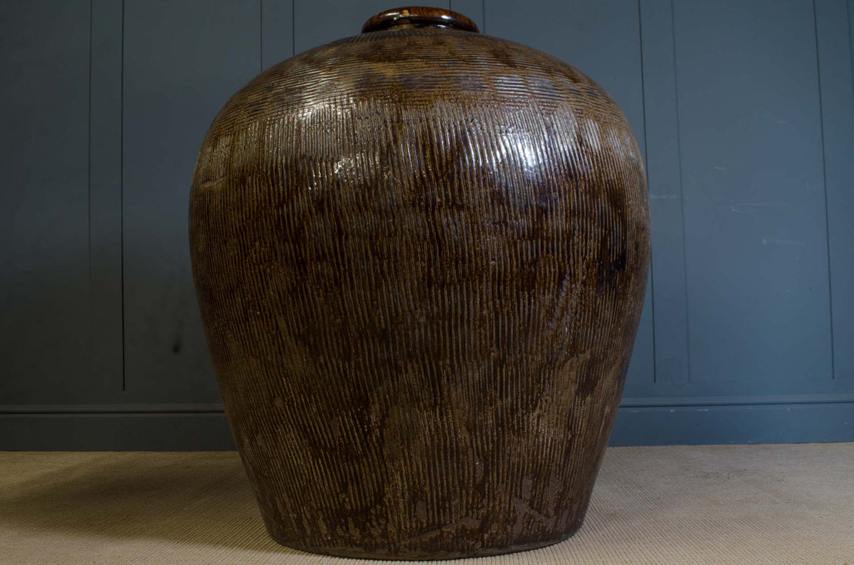 Giant Chinese glazed pottery jar with dark brown textured surface