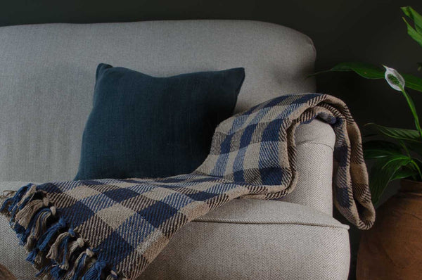Walton & Co Recycled Cotton Check Throw in Blue or green is the perfect way to add cosy texture and eco-conscious elegance to your living space.