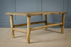 coffee table on sisal carpet with grey walls
