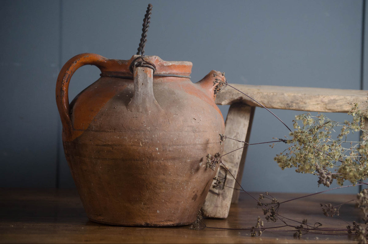 
Old French terracotta jug with orange glaze