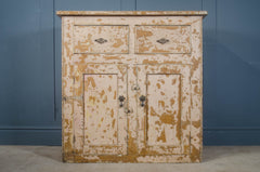 pale pink and mustard chippy painted cupboard