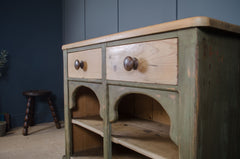Painted pitch pine dresser with distressed olive green finish and storage shelves.