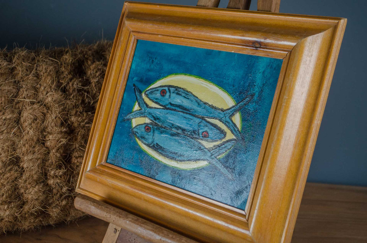 Original painting of three blue fish on a plate