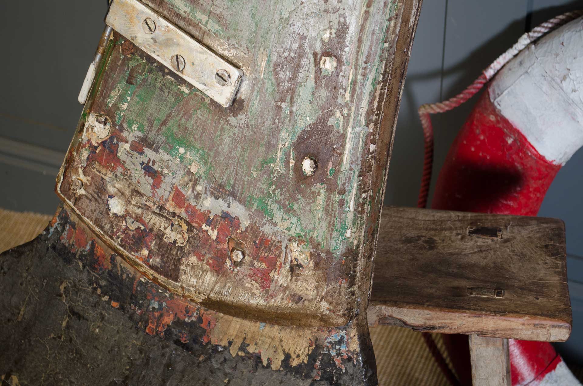 
Close-up of a worn-out metal object with visible rust and wear, possibly a piece of machinery or equipment.