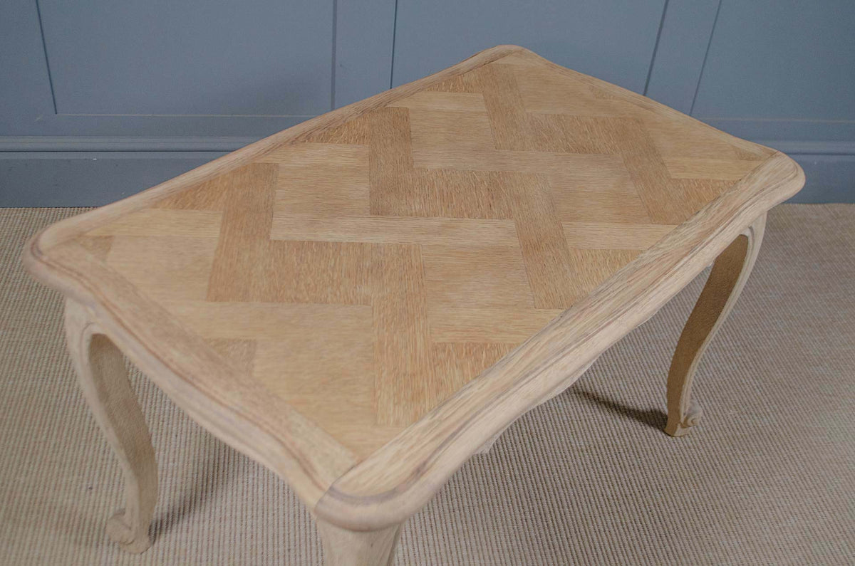 Small French oak coffee table in pale stripped wood