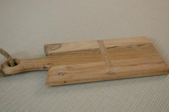 Rustic mango wood cheese board with olives, butter and sourdough bread