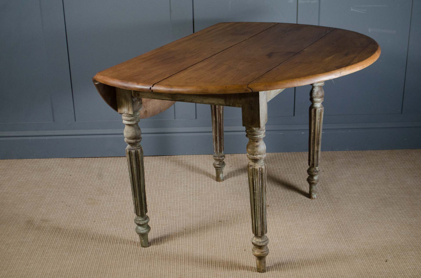 Antique French drop leaf table with turned and fluted legs