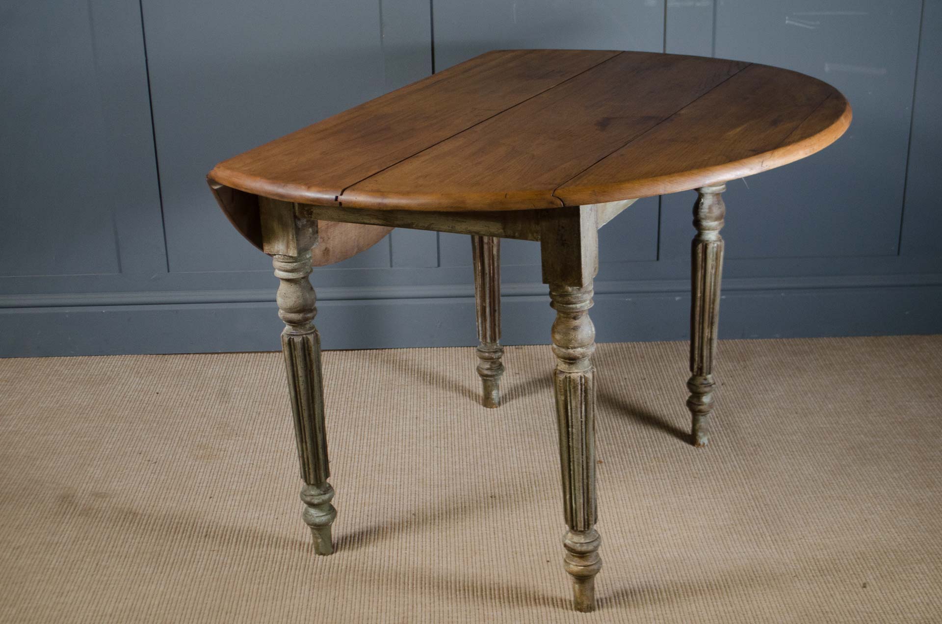
Antique French drop leaf table with turned and fluted legs