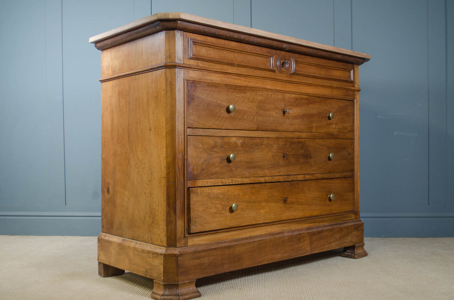 Antique French chest with moulded frieze and brass button handles