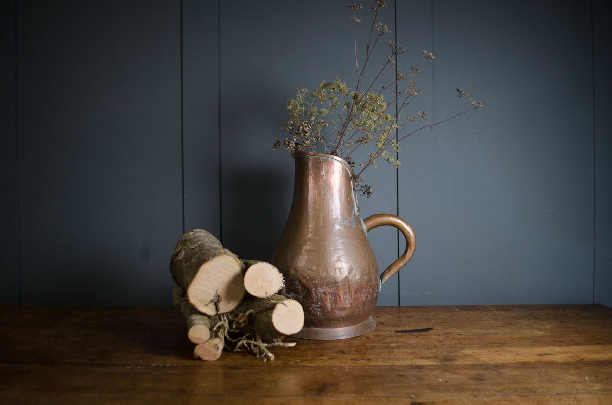 
French hammered copper pitcher with traditional repairs