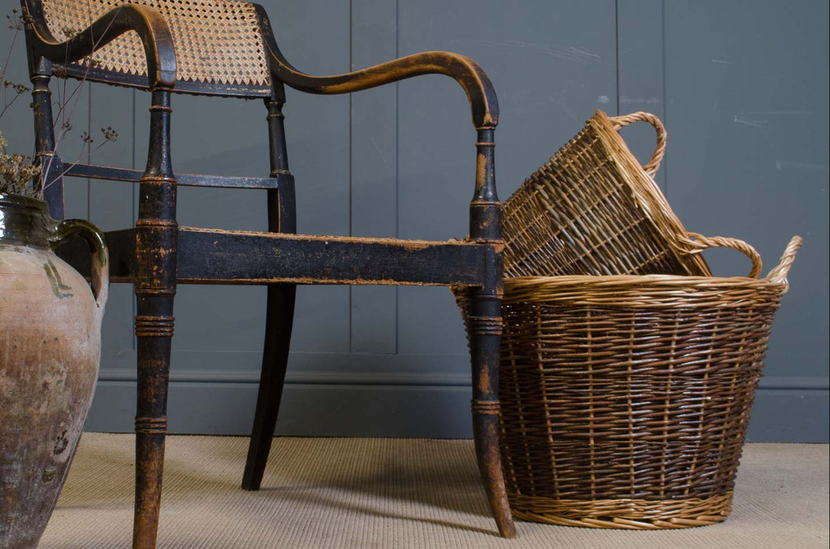 Traditional woven willow log basket with two handles