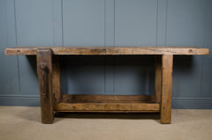 Solid oak carpenter’s bench with aged wood finish and pine stretcher shelf
