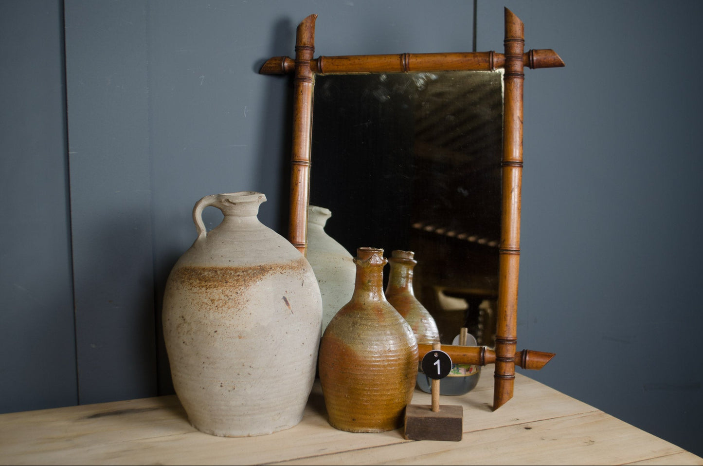 antique French mirror with decorative bamboo frame and foxed mirror plate.