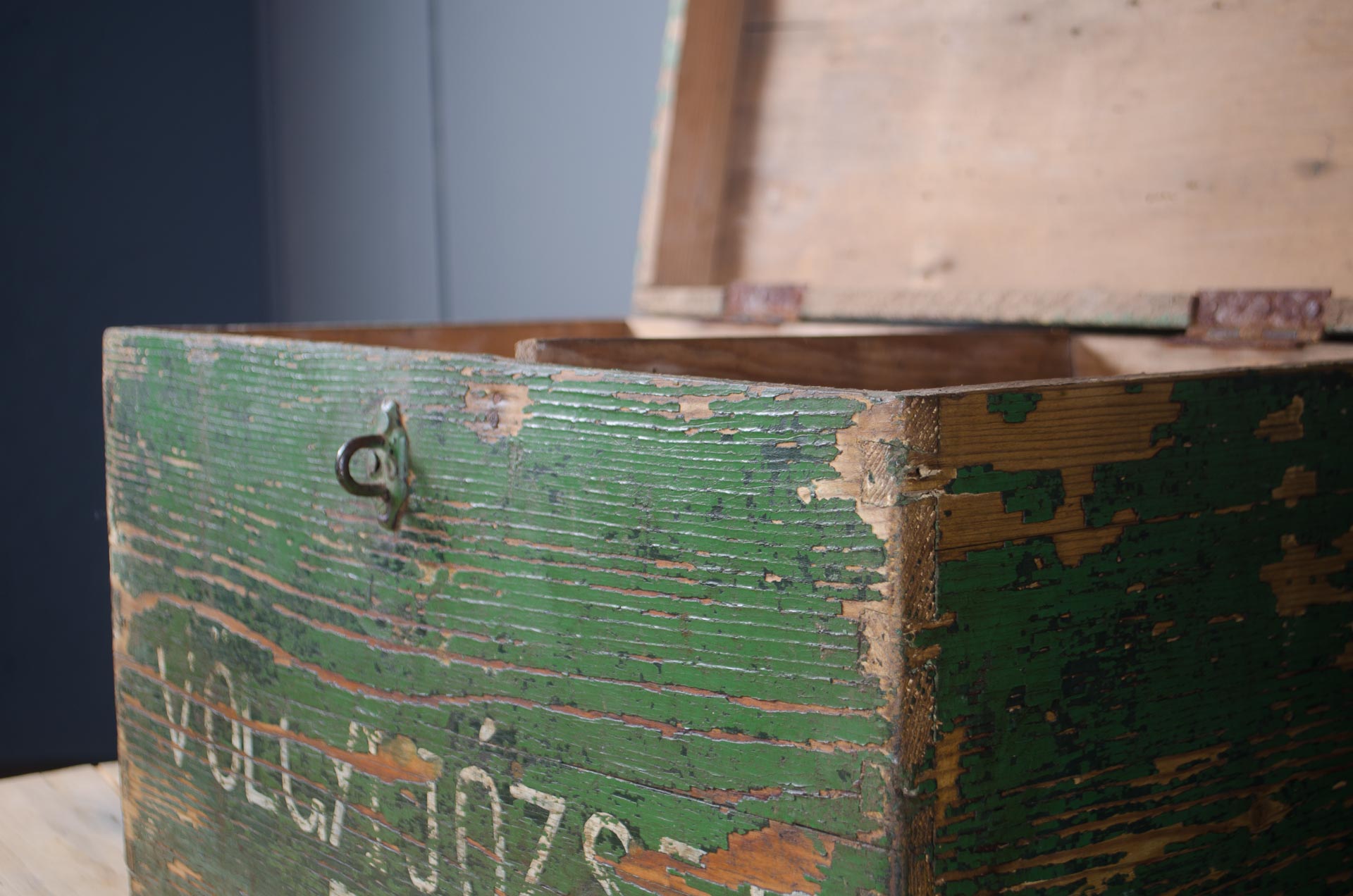 Rustic wooden trunk suitable for hallway or bathroom storage.