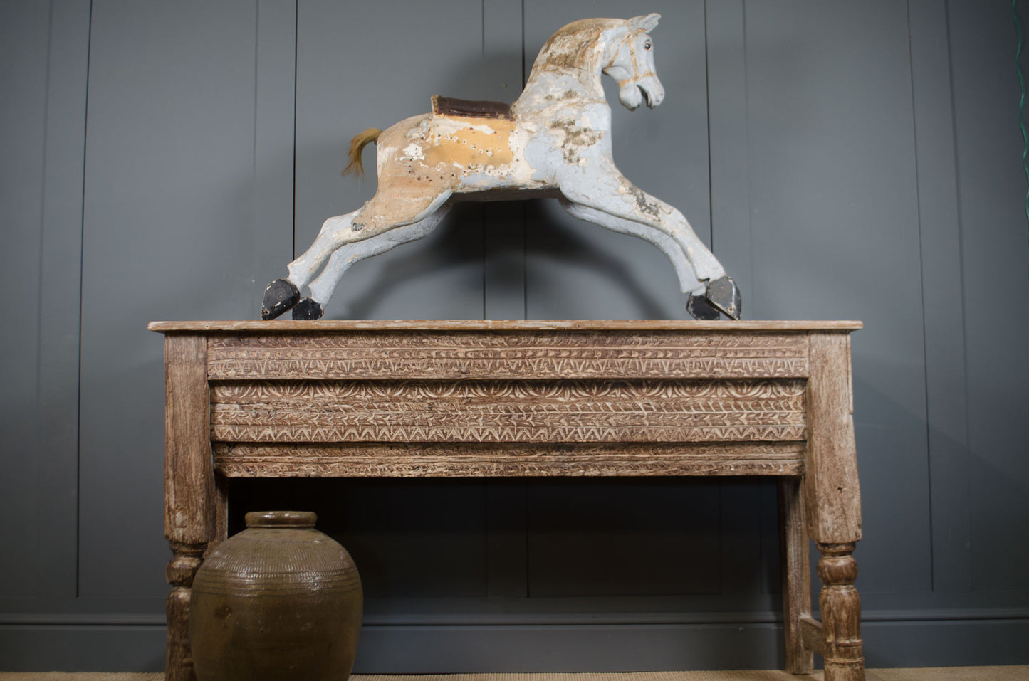 Reclaimed Indian teak console table with limed finish and intricate hand-carved patterns