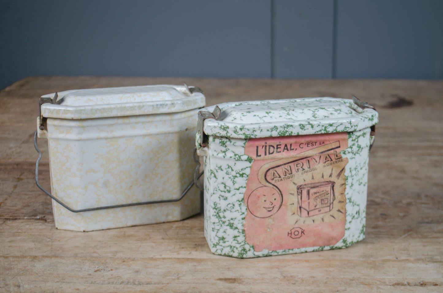 Vintage French enamel splatter lunch tin with original lid, wire handle and printed French label.