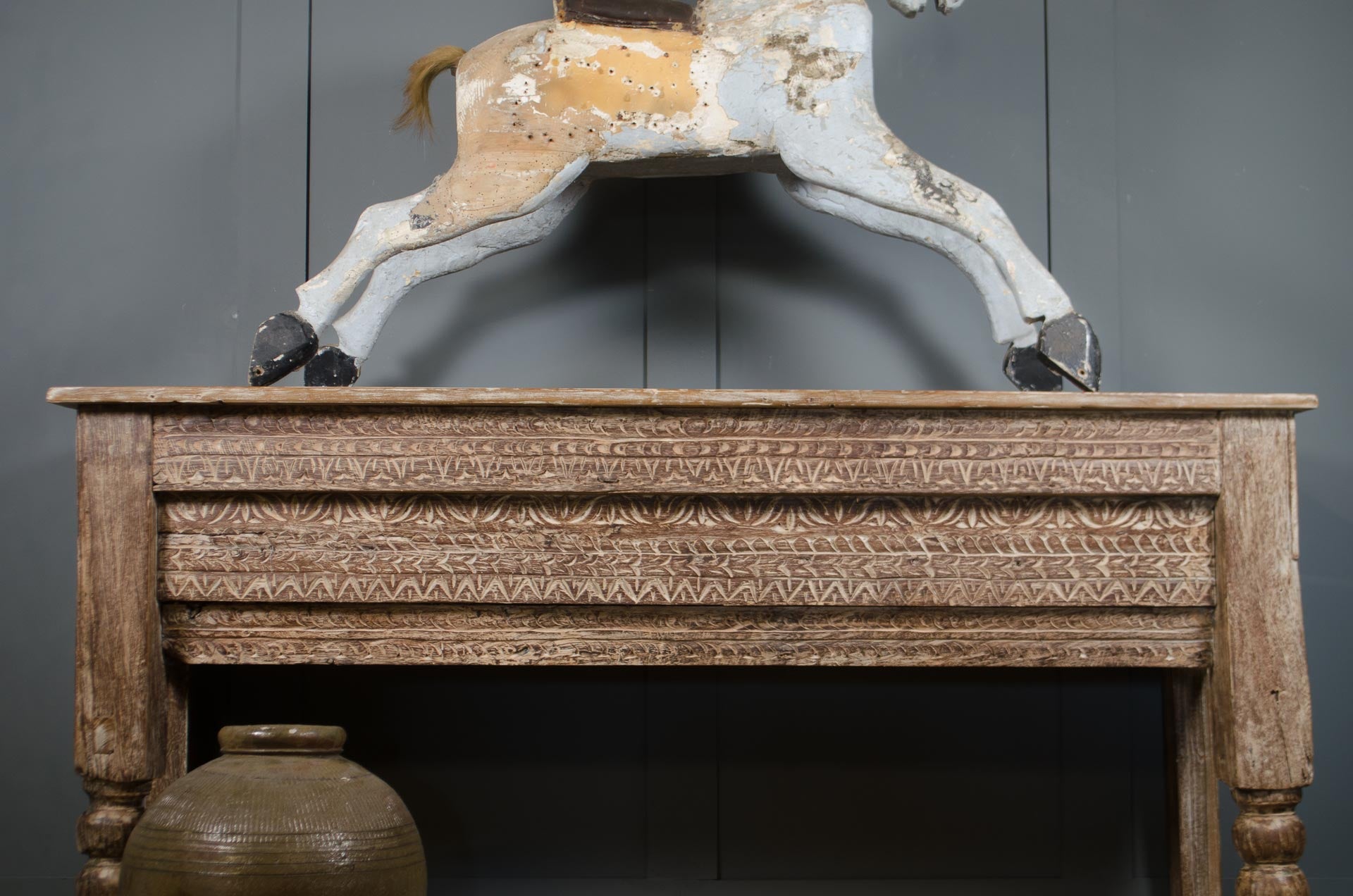 
Antique Indian carved teak console table with geometric detailing and rustic limed wood
