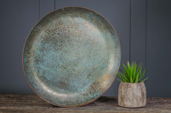 Bring rustic elegance into your home with this handcrafted brass verdigris tray. Featuring a stunning turquoise patina, it’s perfect for holding candles, succulents, or decorative accents. A versatile centerpiece that adds warmth and vintage charm to any table, shelf, or console.